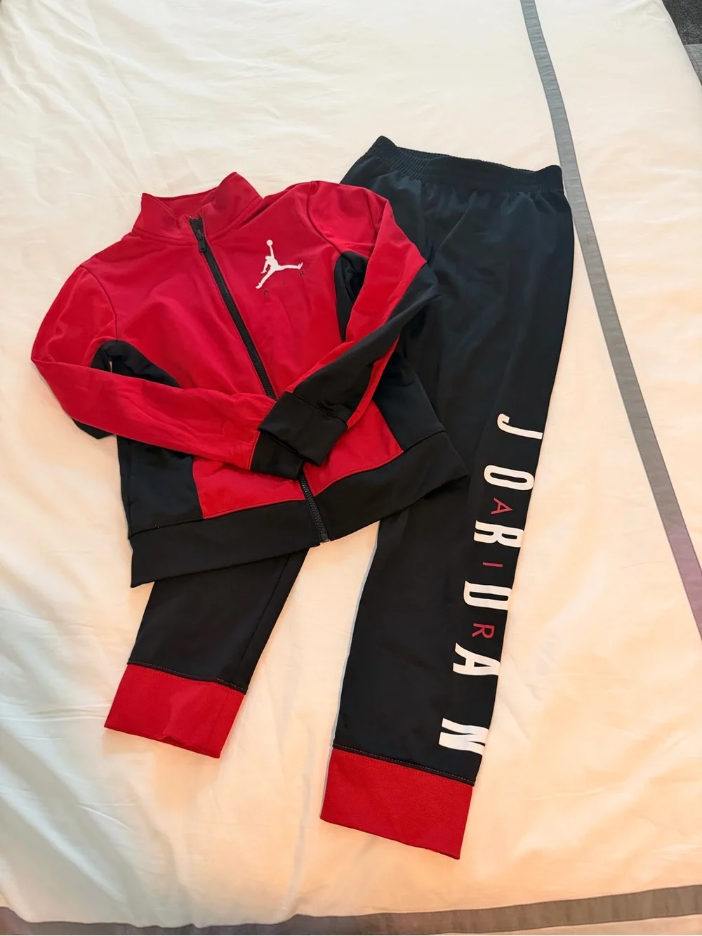Jordan Kids Red and Black Track Set with Logo size medium like new!